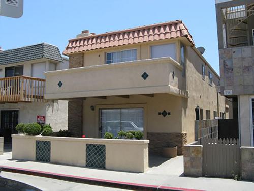 a house on the side of a street at 25 Steps to the Beach in Newport Beach