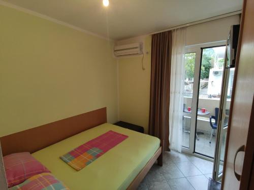 Postel nebo postele na pokoji v ubytování Apartmani Vuković
