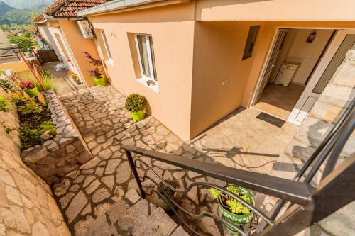 an overhead view of a house with a stone walkway at Guest House Luna in Virpazar