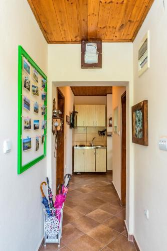 a hallway with a kitchen in a house at Guest House Luna in Virpazar