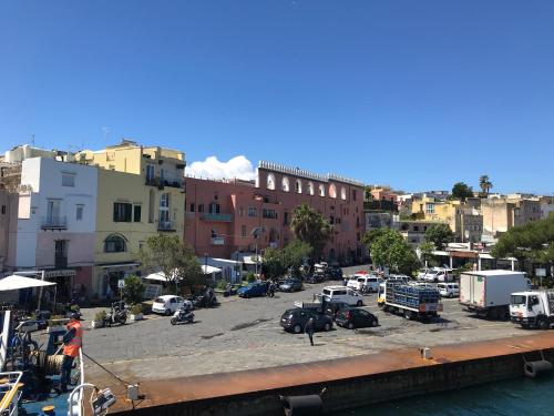 a view of a city with cars parked in a parking lot at Vento di mare in Procida