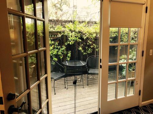 an open door to a patio with a table and chairs at The Inn on First in Napa