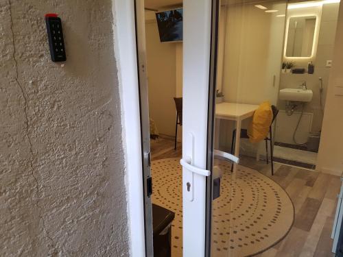 a door leading into a room with a bathroom at Souterrain Solln 20min Oktoberfest/Zentrum in Munich