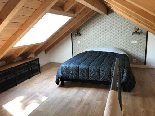 a bedroom with a bed in a attic at Euskal etxea in Bayonne