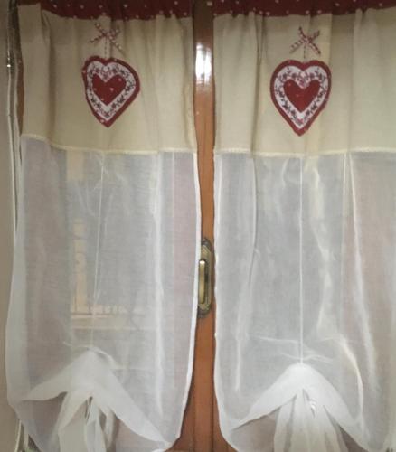 two hearts on the curtains of a window at Pretoria House in Potenza