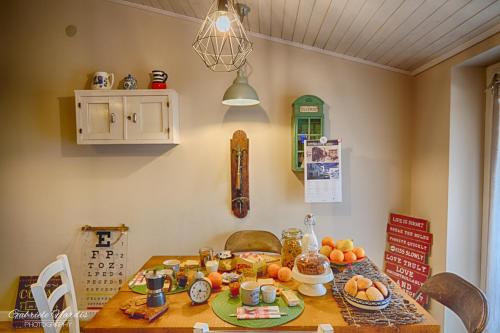 a dining room table with fruit on top of it at Il Piccolo Tibet - Gran Sasso in LʼAquila