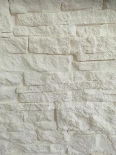 a white brick wall in a building at Pretoria House in Potenza