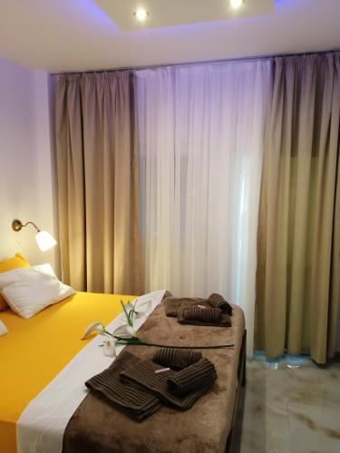 a hotel room with a bed with towels on it at TOTANI LUX in Perea