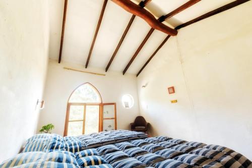 Ένα ή περισσότερα κρεβάτια σε δωμάτιο στο YVY CASA HOTEL