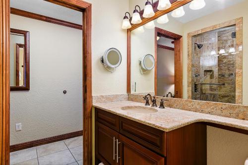 a bathroom with a sink and a mirror at Condos at Canyons Resort by White Pines in Park City