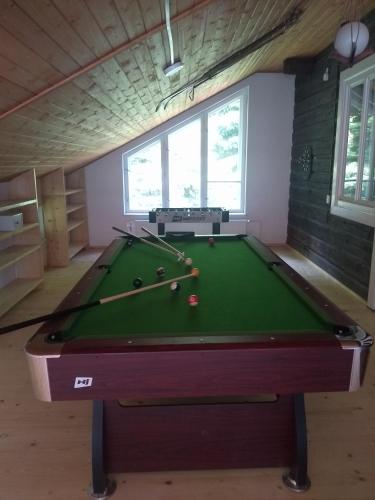 a pool table in a living room with a pool table at Willa Wiślok in Wisła