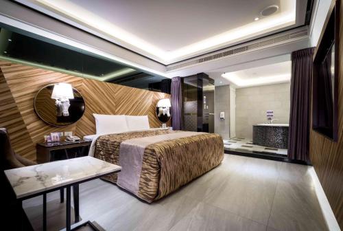 Lova arba lovos apgyvendinimo įstaigoje OUGE Motel - Fengshan