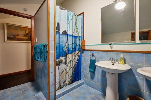 a bathroom with a shower and a sink at A Room With a View in Kaikoura