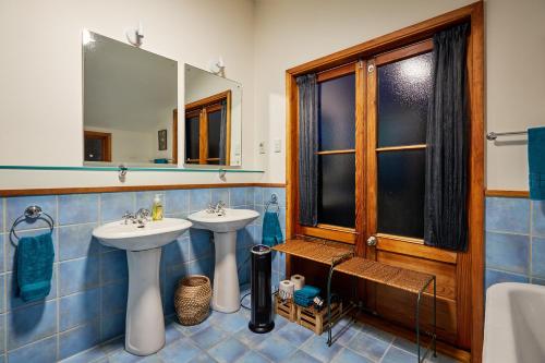 a bathroom with two sinks and a mirror at A Room With a View in Kaikoura