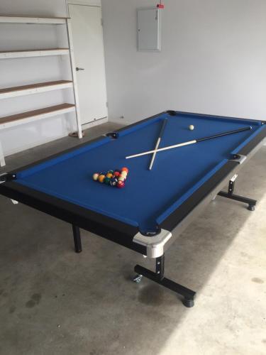 A pool table at Family Friendly Holiday Home