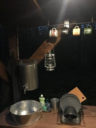 a counter with a bowl and a mixer on a table at Tahkuna tree-house in Malvaste