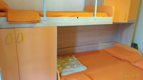 a bunk bed with two beds in a room at Villetta Carati in Torre dell'Orso