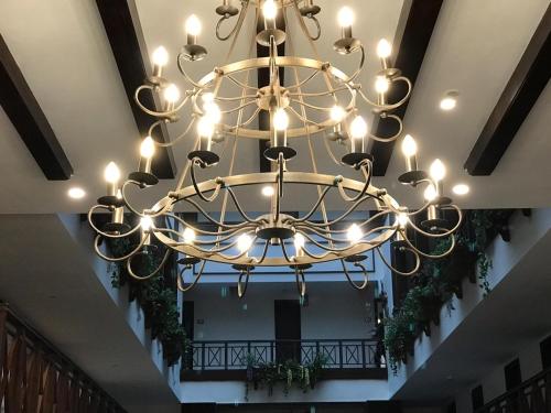 a large chandelier hanging from the ceiling of a building at The Fern Brentwood Resort, Mussoorie in Mussoorie