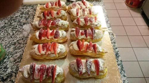 a bunch of strawberries on buns on a counter at Agriturismo SANGALLO in bedizzol