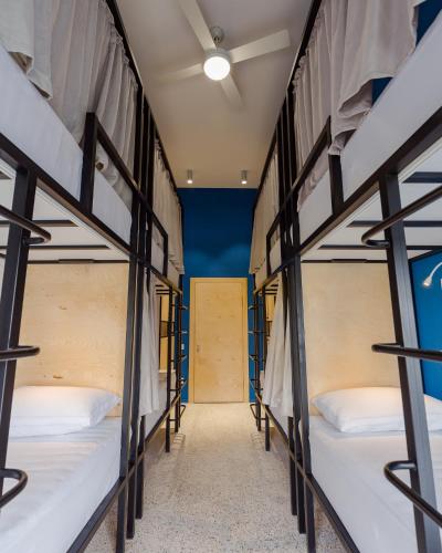a row of bunk beds in a dorm room at Back2ME in Batumi