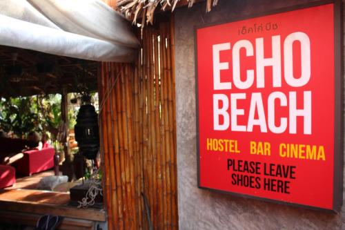 a sign on a building that says don't drink at Echo Beach Hostel in Ban Tai