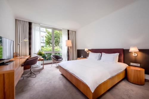 Säng eller sängar i ett rum på Dorint City-Hotel Bremen