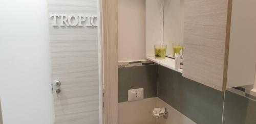 a bathroom with a shower and a toilet in a room at ele&gio accomodation in Tropea