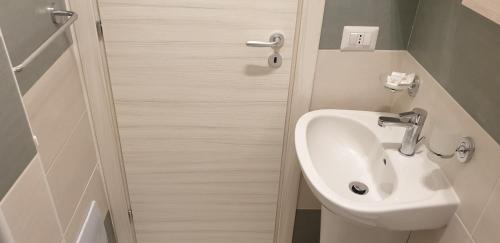 a bathroom with a toilet and a sink at ele&gio accomodation in Tropea