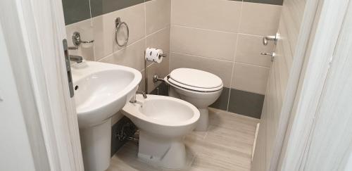 a bathroom with a toilet and a sink at ele&gio accomodation in Tropea