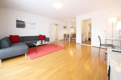 a living room with a couch and a table at CITY STAY - Kirchweg in Zürich