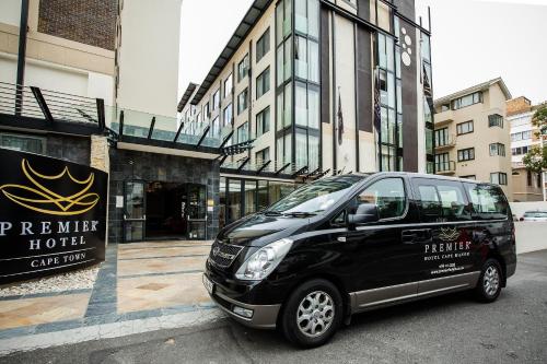 a black van parked in front of a building at Premier Hotel Cape Town in Cape Town