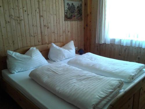 Ένα ή περισσότερα κρεβάτια σε δωμάτιο στο Haus Julia