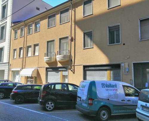 a van parked in a parking lot in front of a building at Pane&Burro in Vercelli