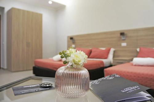 Ένα ή περισσότερα κρεβάτια σε δωμάτιο στο Albergo D'Onofrio