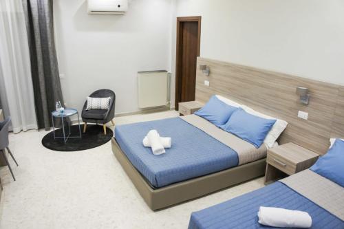 Ένα ή περισσότερα κρεβάτια σε δωμάτιο στο Albergo D'Onofrio