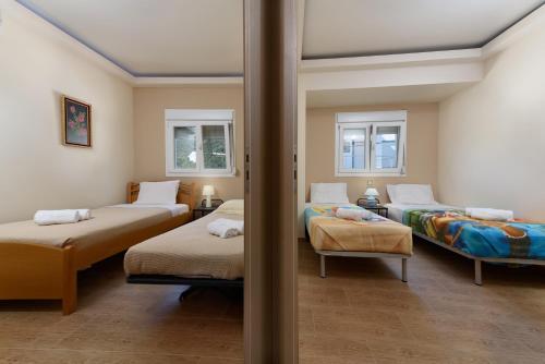 A bed or beds in a room at Beach Front Condo South Crete