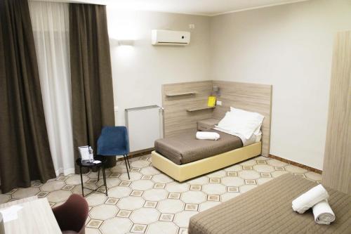 Ένα ή περισσότερα κρεβάτια σε δωμάτιο στο Albergo D'Onofrio