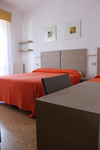 A bed or beds in a room at pensione licia