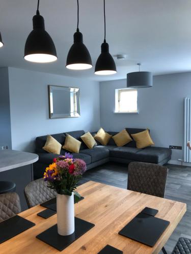 a living room with a couch and a table at Apt 2, Frasers Close in Kirkwall