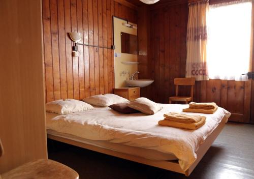 Cama o camas de una habitación en Hôtel de Torgon