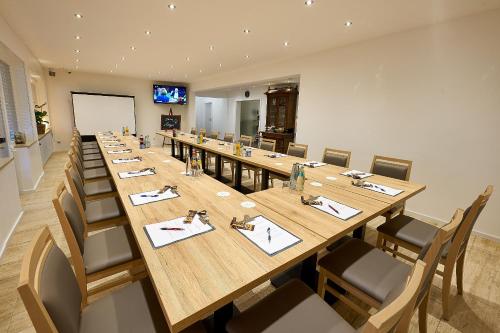 a large conference room with a long table and chairs at Sonnenuhr in Bernkastel-Kues