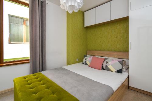 En eller flere senge i et værelse på The Cozy Apartment