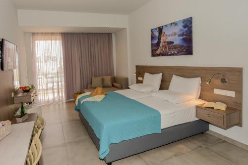 a bedroom with a large bed in a room at Blue Horizon Apartments in Balíon