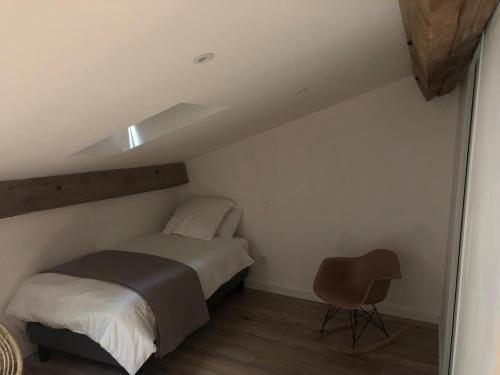 a bedroom with a bed and a desk at Maison Simonenia in Saint-Jean-Pied-de-Port