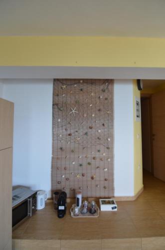 a room with a wall with a stone wall at La Casa Azul in Arkoudi