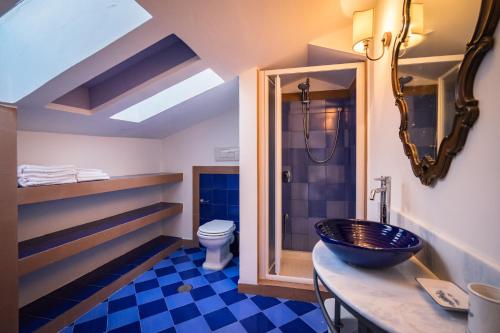 a bathroom with a sink and a toilet at Borgo dei Saraceni - Domus Indomita in Agropoli