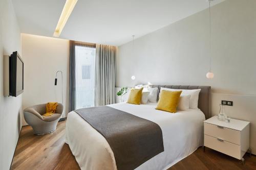 Ένα ή περισσότερα κρεβάτια σε δωμάτιο στο Ohla Barcelona