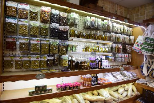 a store filled with lots of different types of goods at Blue Horizon Apartments in Balíon