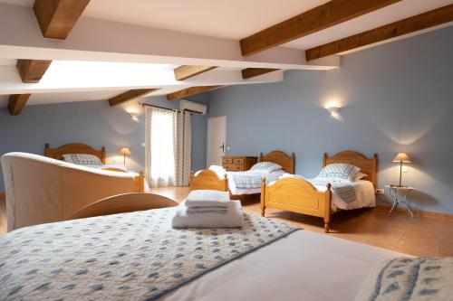 Postel nebo postele na pokoji v ubytování Le Relais Du Grand Logis
