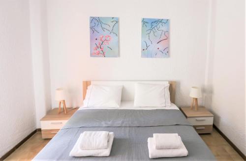 Ένα ή περισσότερα κρεβάτια σε δωμάτιο στο Beachfront deluxe apt.